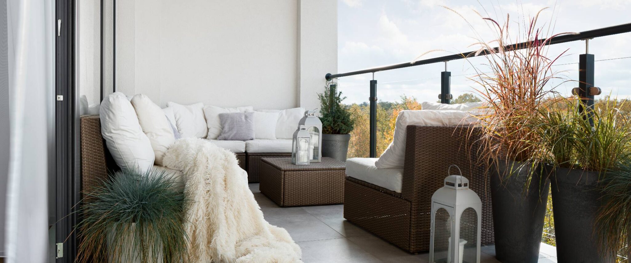 decorated balcony with plants and seating