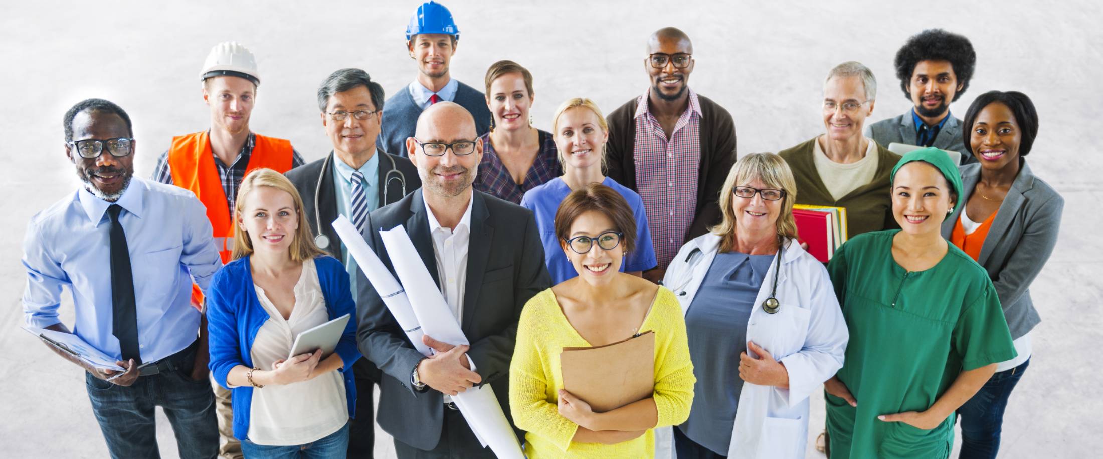 A group of people wearing their work outfits and showcasing a diverse career path