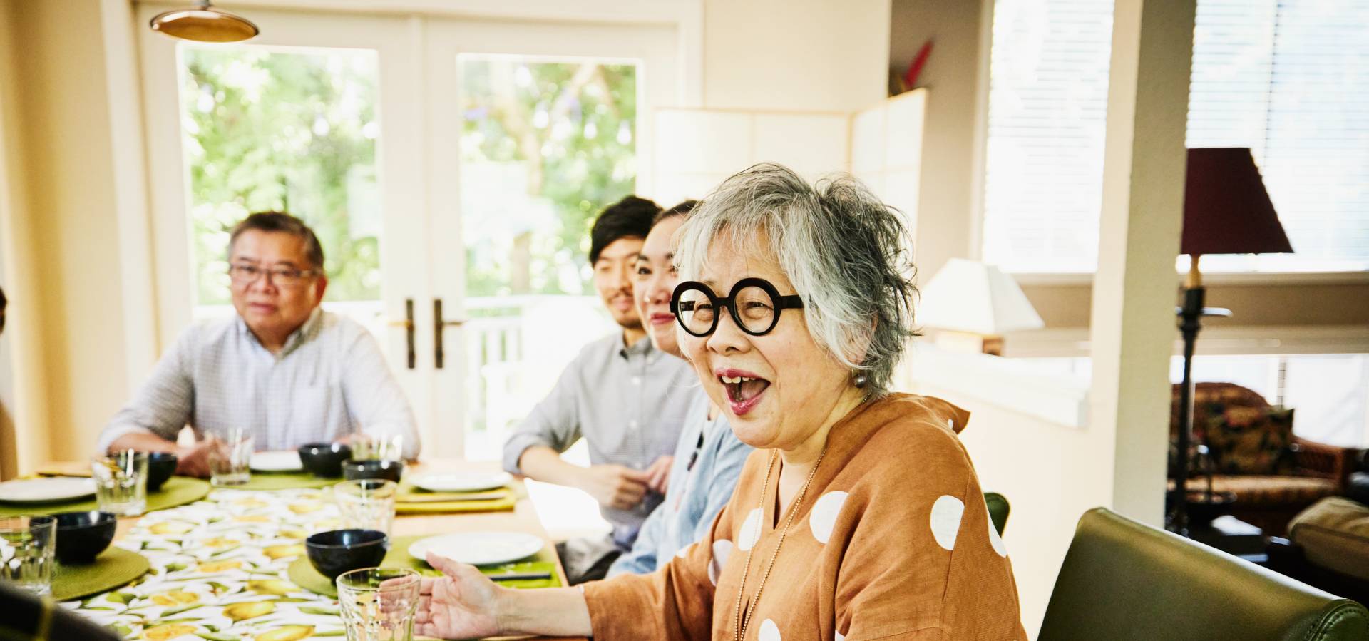 happy active seniors enjoying a meal together