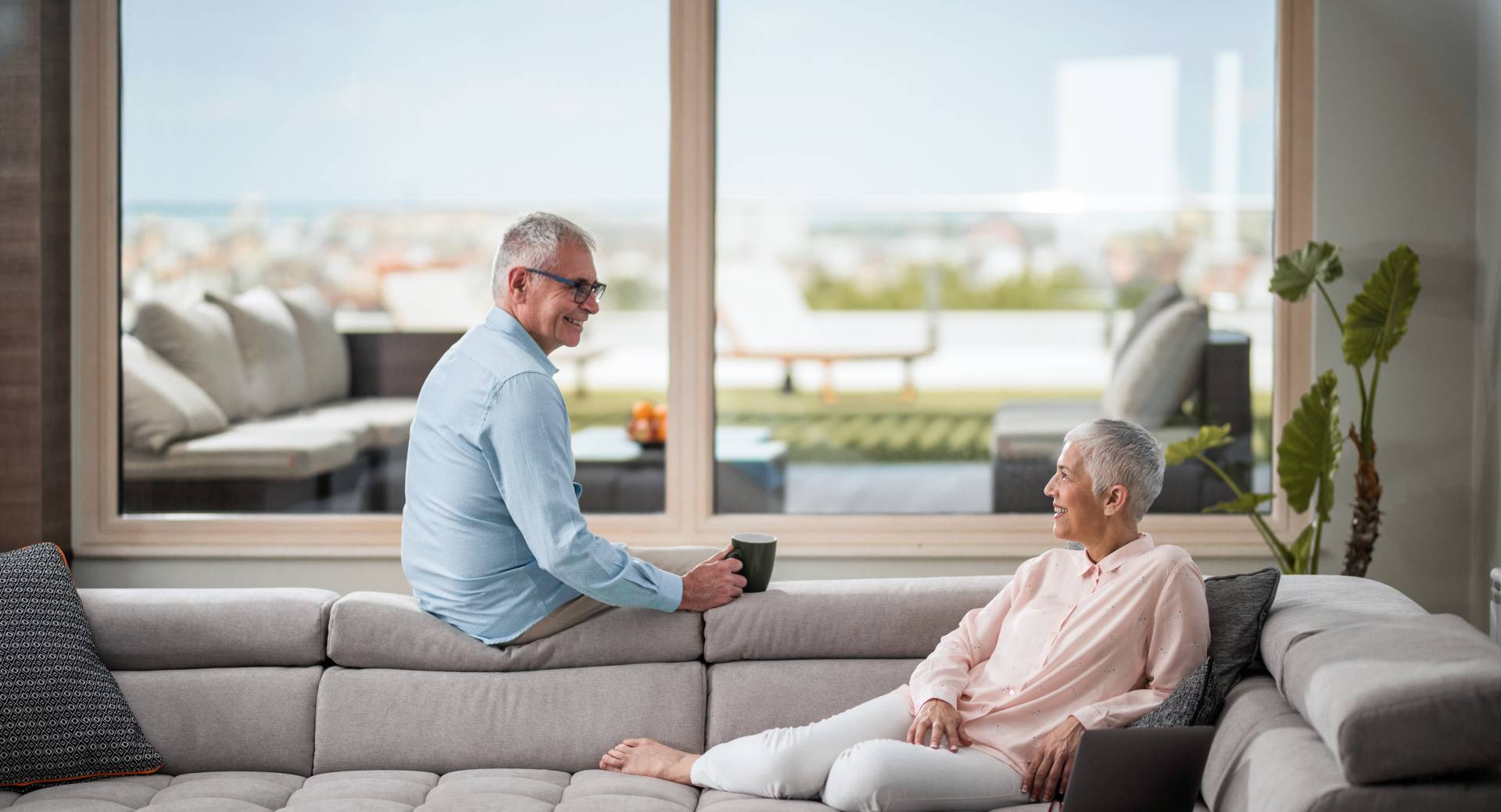 happy older adults enjoying their new spacious senior living apartment