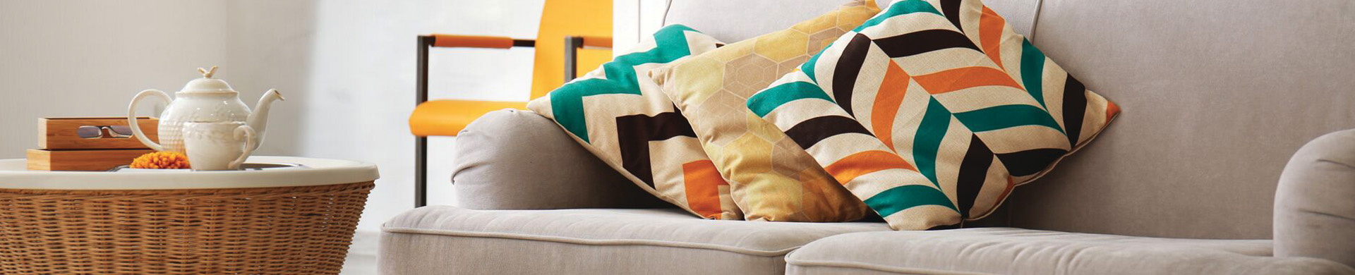 cropped photo of a couch with pillows
