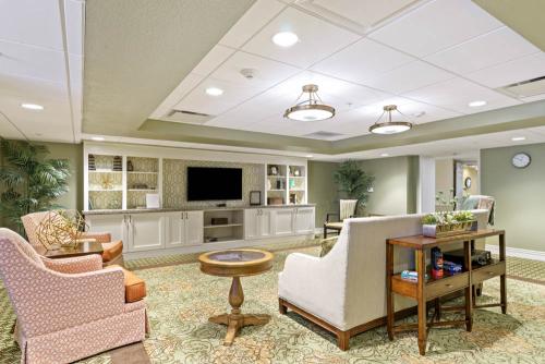living room with couch, chairs and television