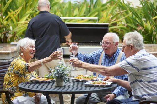 residents enjoying drinks and food